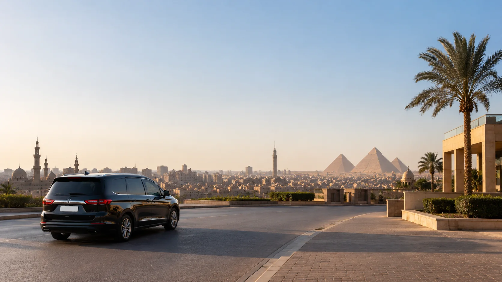 Private transfer vehicle arriving in Cairo with the city and pyramids in the distance